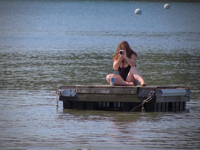 Megan taking a photo from the floating dock